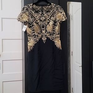 An elegant Neiman Marcus Dress (black & gold size 4)